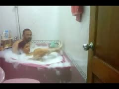 Chunky Indian housewife with her hubby in the bathtub